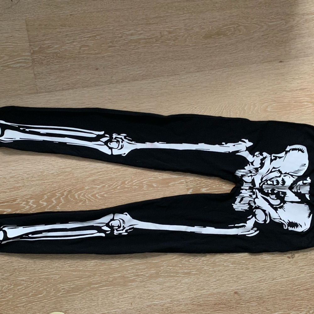 Black leggings with skeleton design on the front.